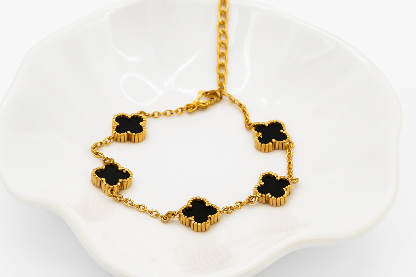 Elegant Gold Clover Bracelet with Black Onyx Charms