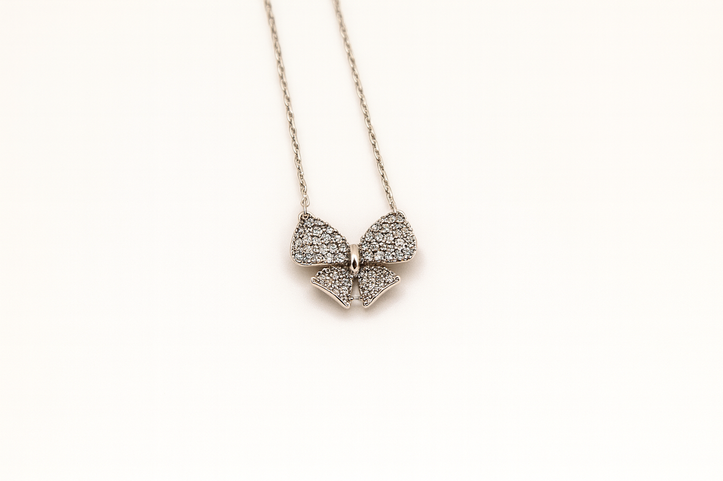 Elegant Bow Pendant Necklace with Sparkling CZ Stones
