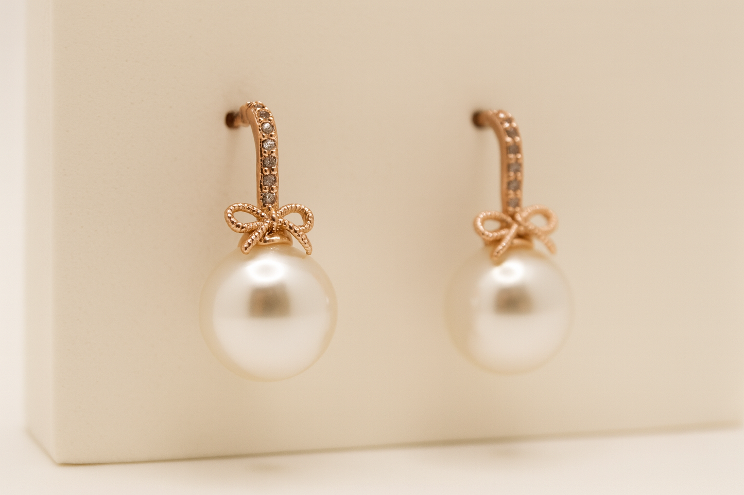 Elegant Pearl Drop Earrings with Bow Accent